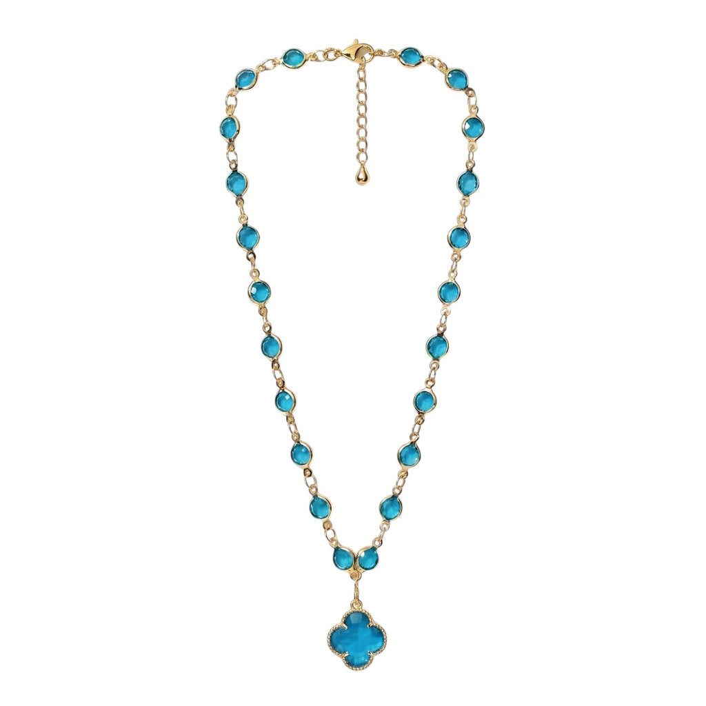 KEVOUR 18K gold-filled station necklace featuring vivid blue cubic zirconia stones and a matching clover pendant.