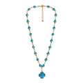KEVOUR 18K gold-filled station necklace featuring vivid blue cubic zirconia stones and a matching clover pendant.