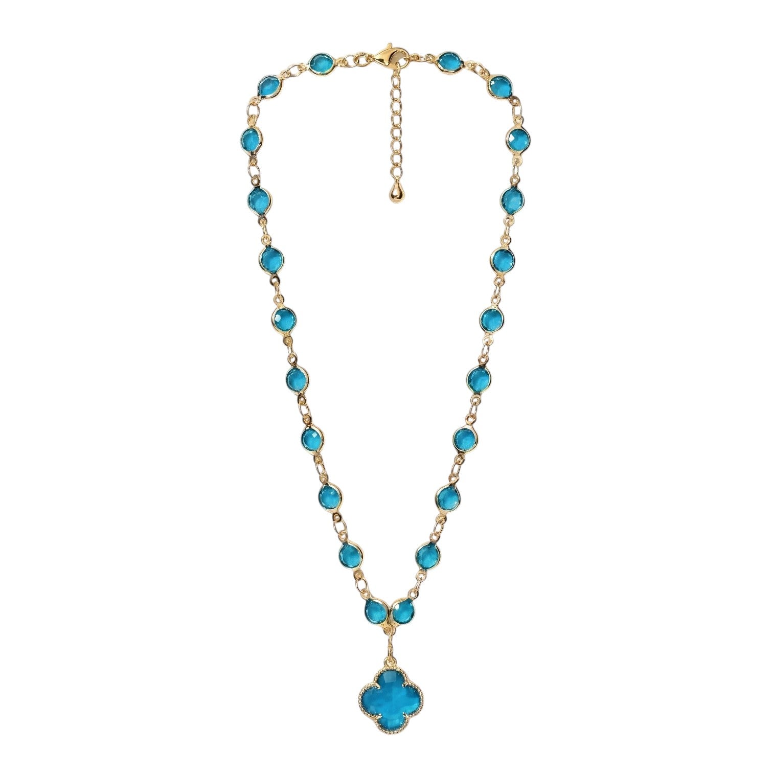 KEVOUR 18K gold-filled station necklace featuring vivid blue cubic zirconia stones and a matching clover pendant.