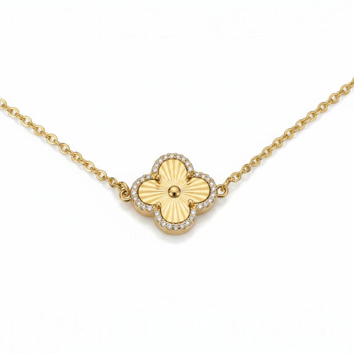 KEVOUR 18K gold-filled clover bracelet featuring a fluted gold charm framed with pavé cubic zirconia on a gold chain.