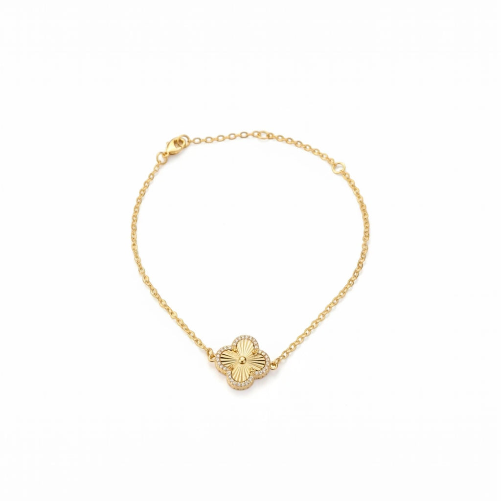KEVOUR 18K gold-filled clover bracelet with a fluted gold center and pavé cubic zirconia accents on a delicate chain.