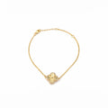 KEVOUR 18K gold-filled clover bracelet with a fluted gold center and pavé cubic zirconia accents on a delicate chain.